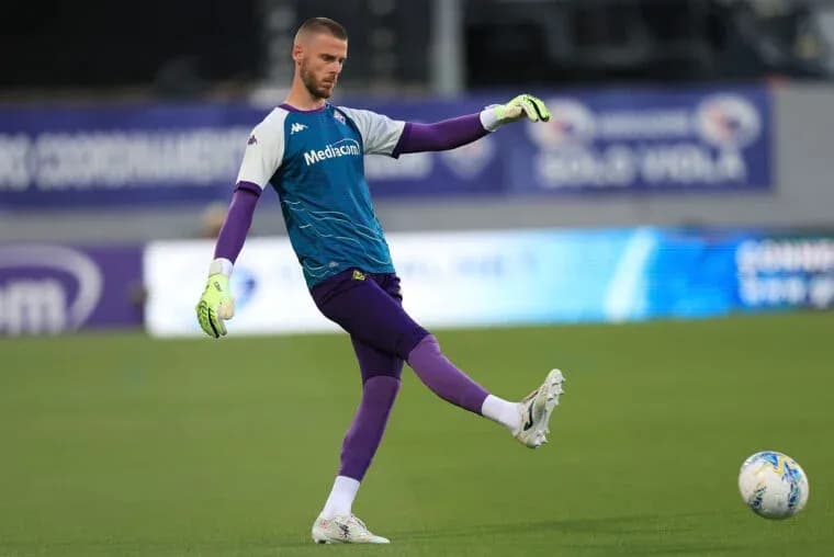 Goalkeeper practicing kicking the ball during warm-up Goalkeeper practicing kicking the ball during warm-up