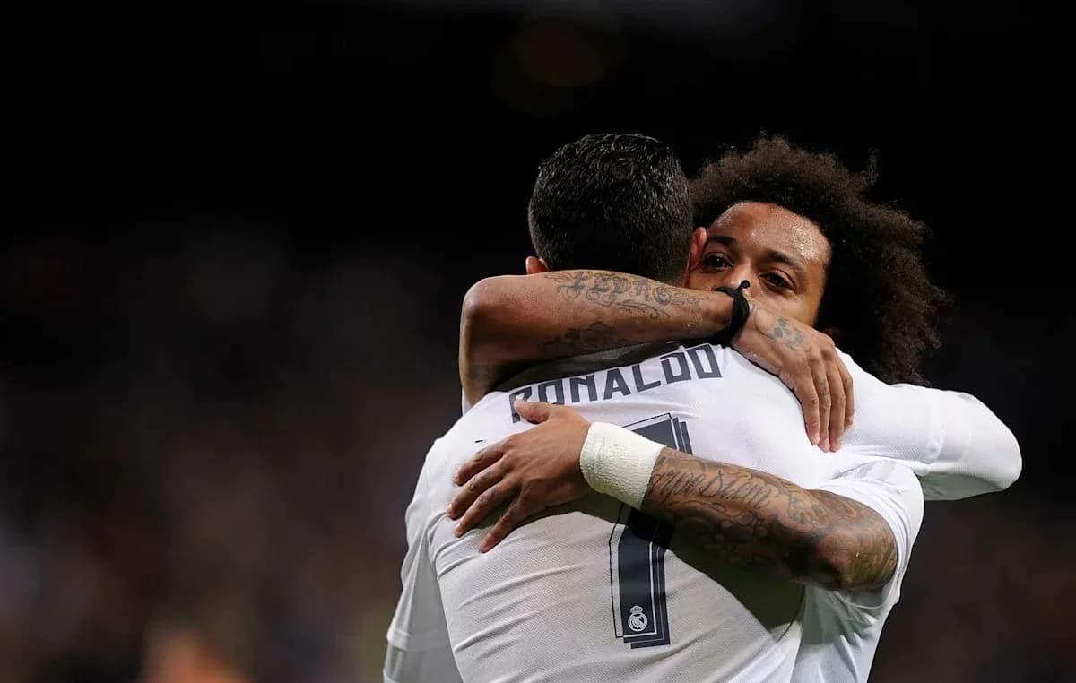 Cristiano Ronaldo and Marcelo embracing on field Cristiano Ronaldo and Marcelo embracing on field