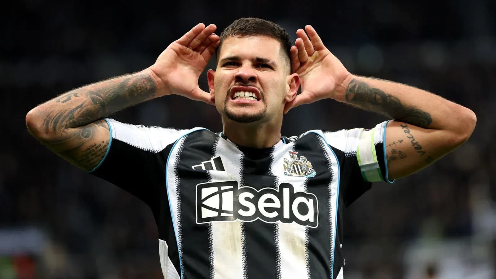 Player celebrating with hands to ears after goal Player celebrating with hands to ears after goal