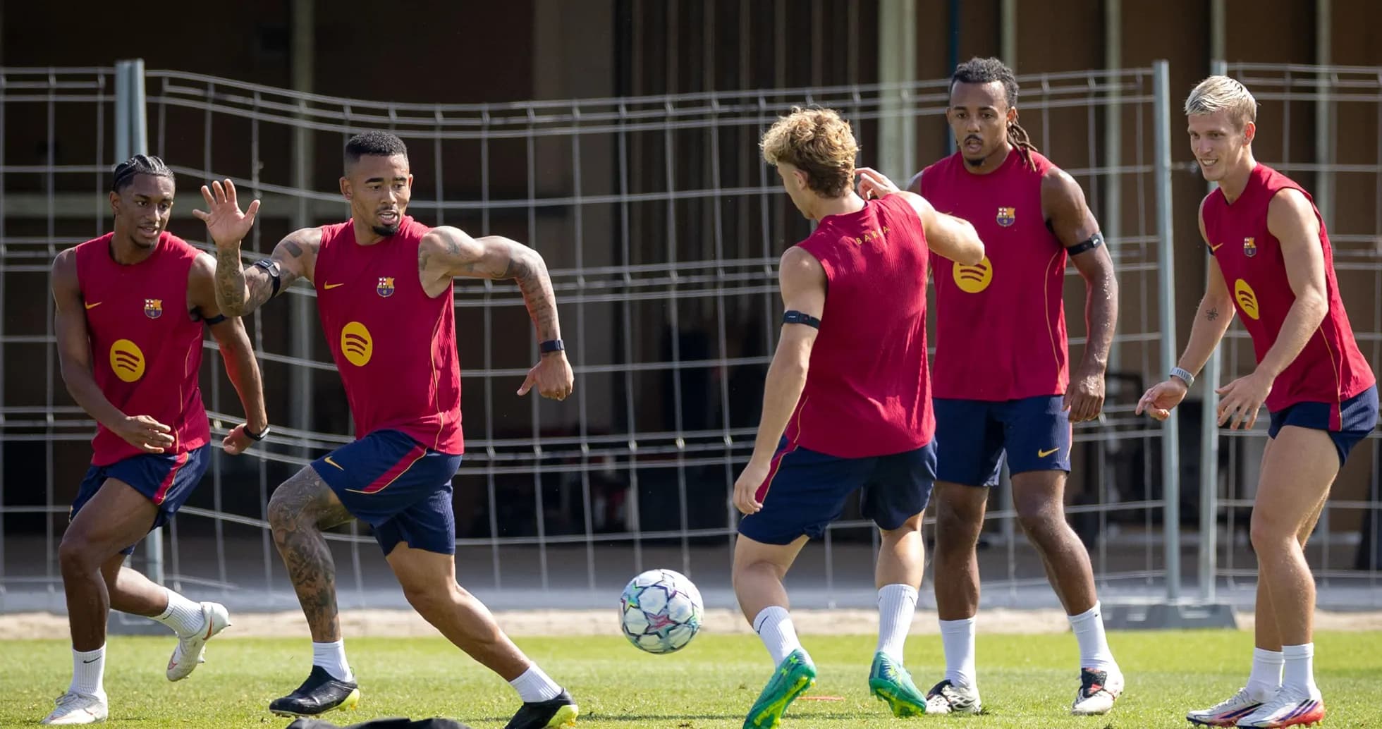 Barcelona players training and passing a football Barcelona players training and passing a football