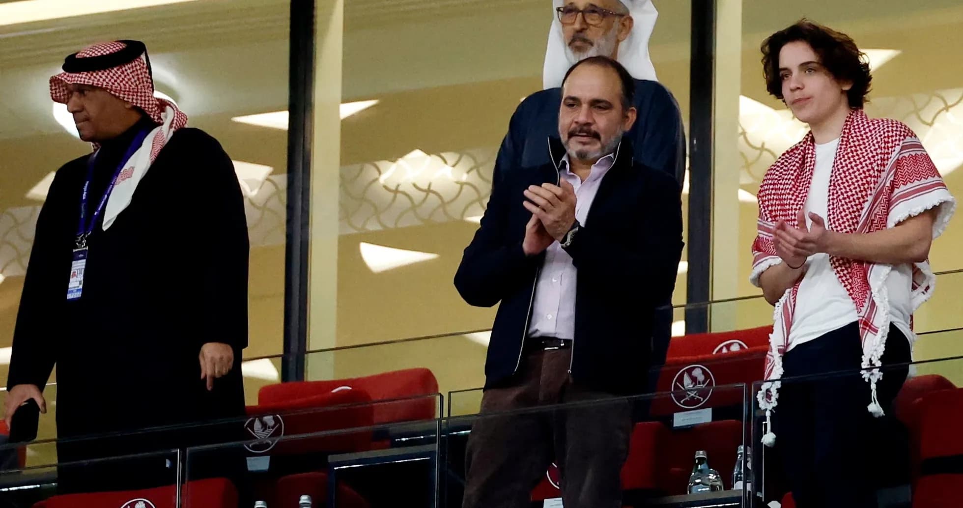 Spectators applauding from VIP box at stadium Spectators applauding from VIP box at stadium