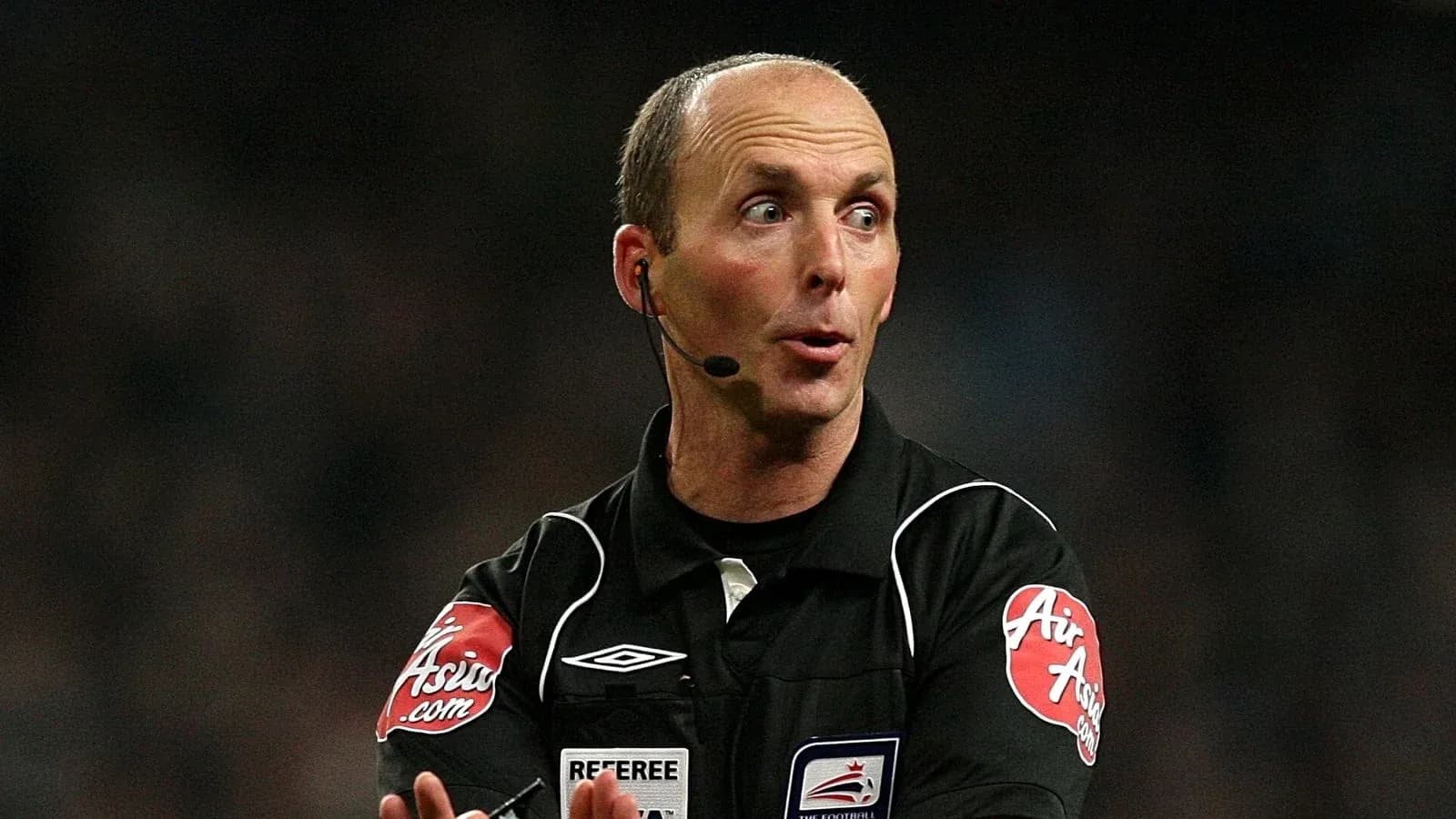 Referee gesturing during a football match Referee gesturing during a football match