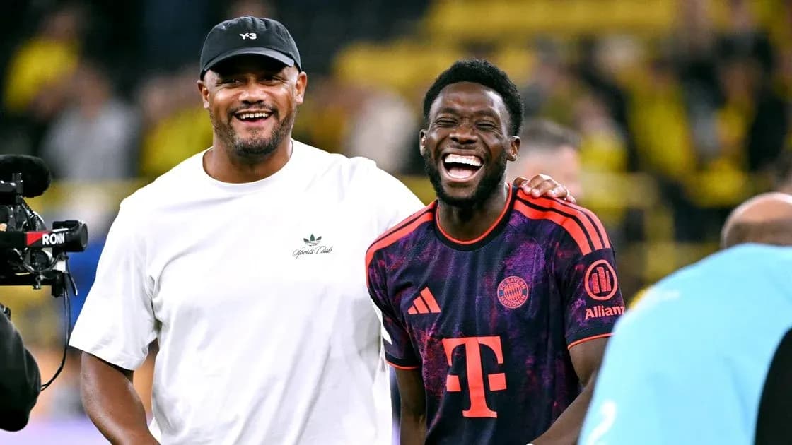 Two men smiling and laughing on the field Two men smiling and laughing on the field