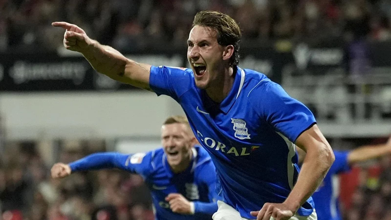 Birmingham City player celebrating a goal enthusiastically Birmingham City player celebrating a goal enthusiastically