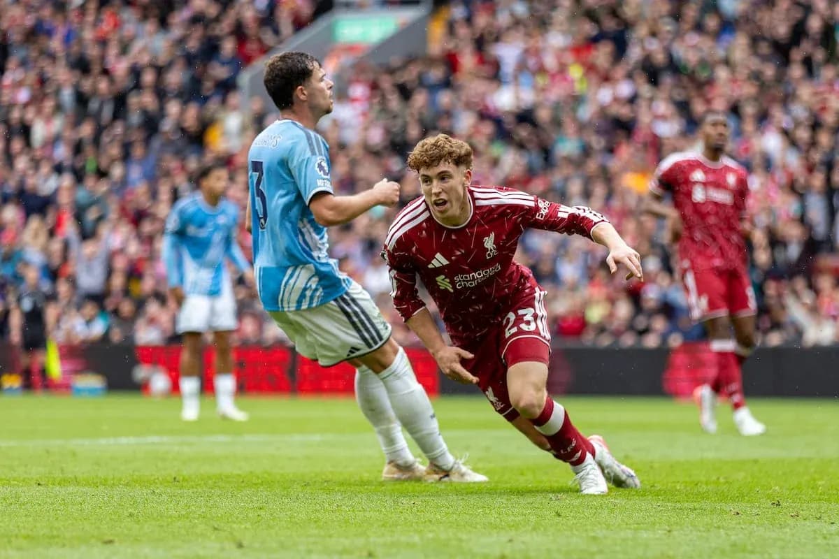 Liverpool player dribbling past Nottingham Forest defender Liverpool player dribbling past Nottingham Forest defender