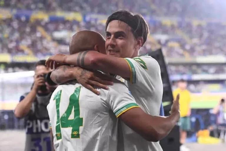 Players celebrating with an embrace after match Players celebrating with an embrace after match