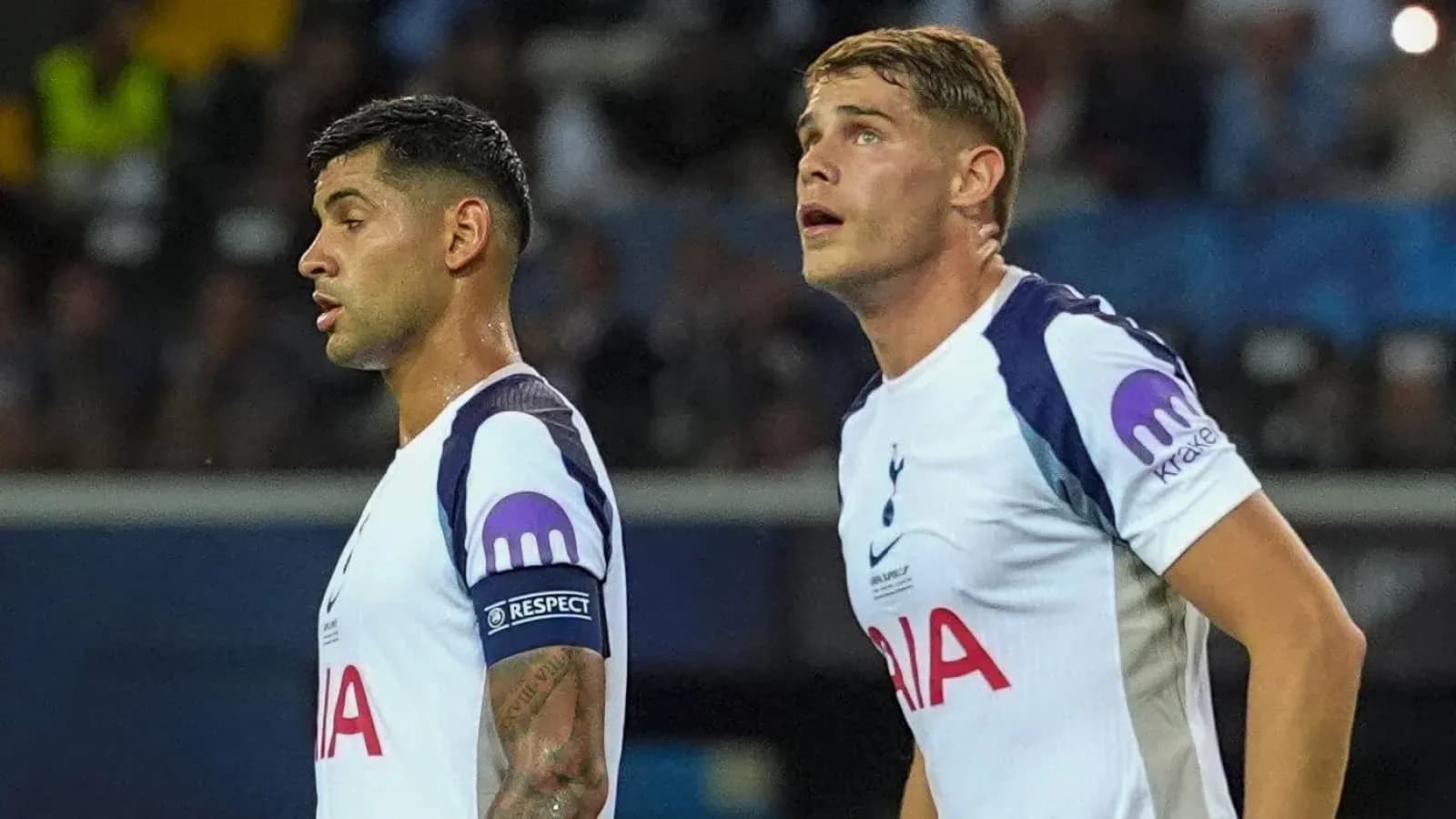 Two Tottenham players looking towards the field Two Tottenham players looking towards the field