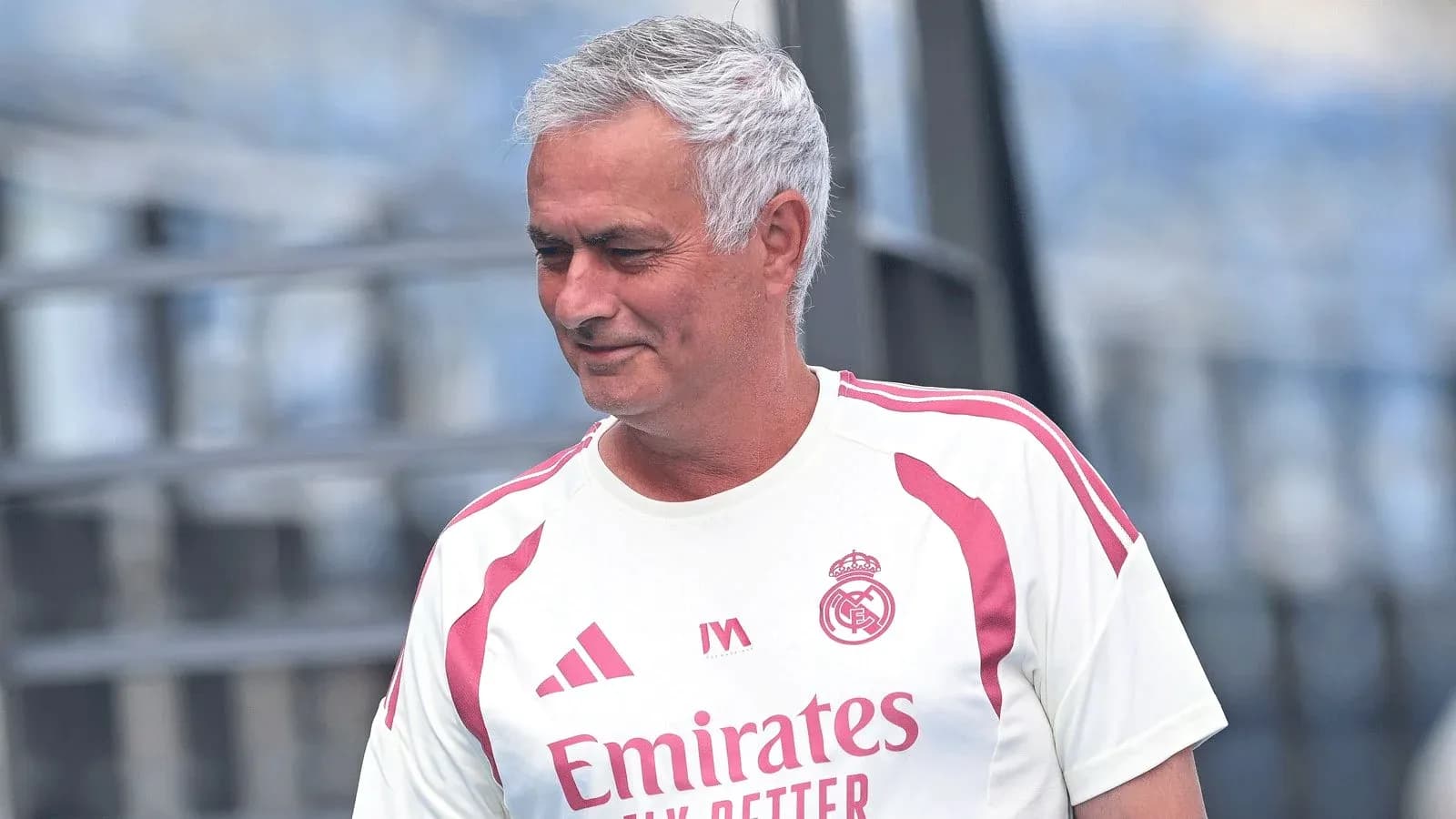 Coach in Real Madrid training kit on pitch Coach in Real Madrid training kit on pitch