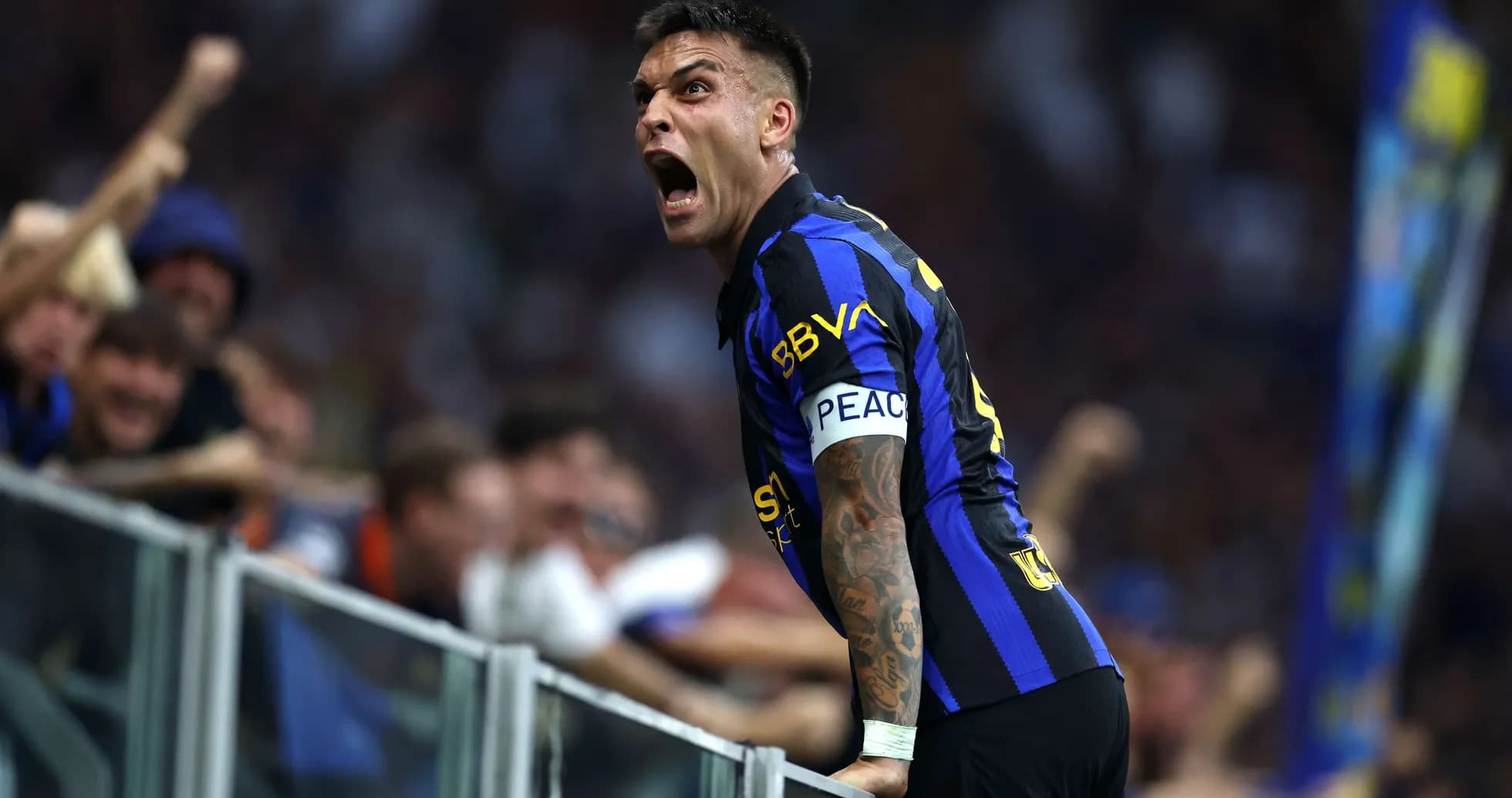 Lautaro Martinez celebrating with fans during match Lautaro Martinez celebrating with fans during match