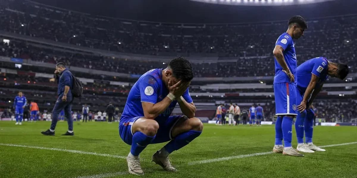 Player kneeling on field with head in hands Player kneeling on field with head in hands
