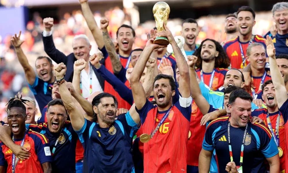 Spain team celebrating victory with World Cup trophy Spain team celebrating victory with World Cup trophy