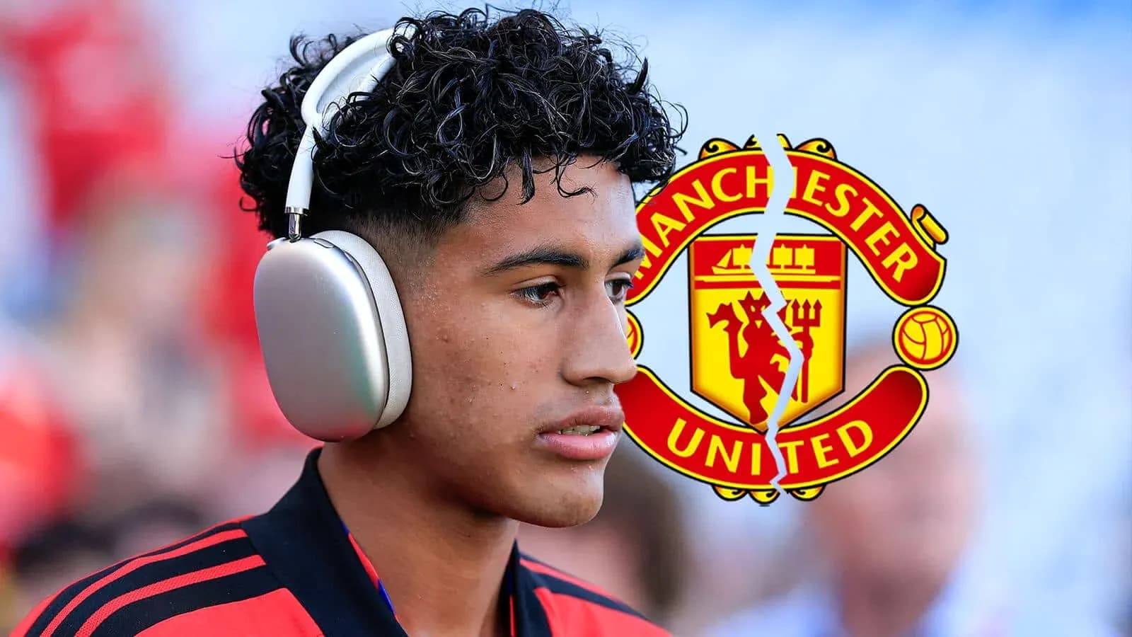 Player wearing headphones with Manchester United logo Player wearing headphones with Manchester United logo