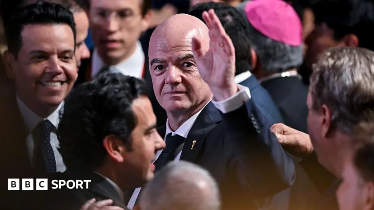 Man waving at event surrounded by attendees Man waving at event surrounded by attendees