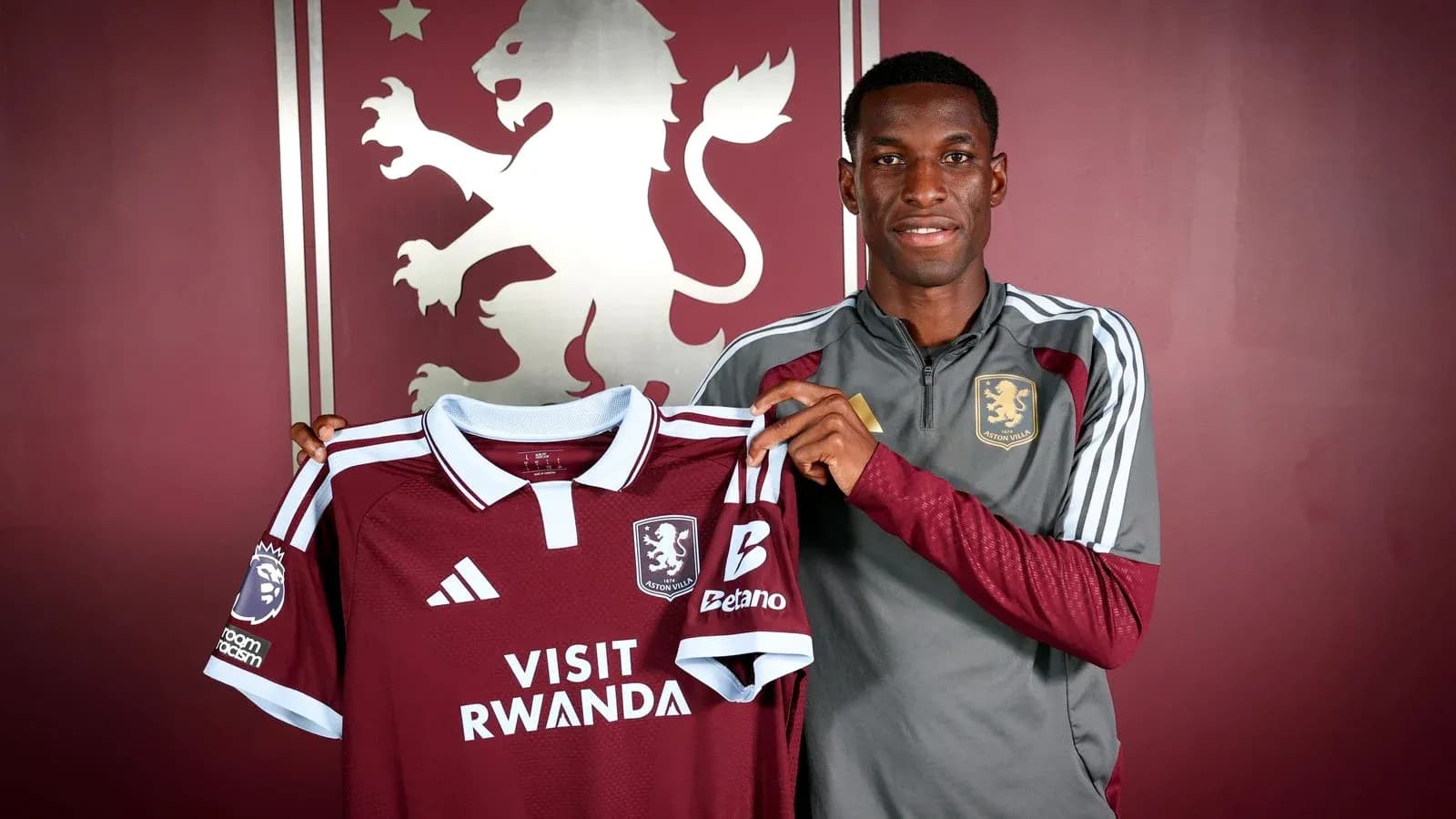 Player holding Aston Villa jersey during presentation Player holding Aston Villa jersey during presentation