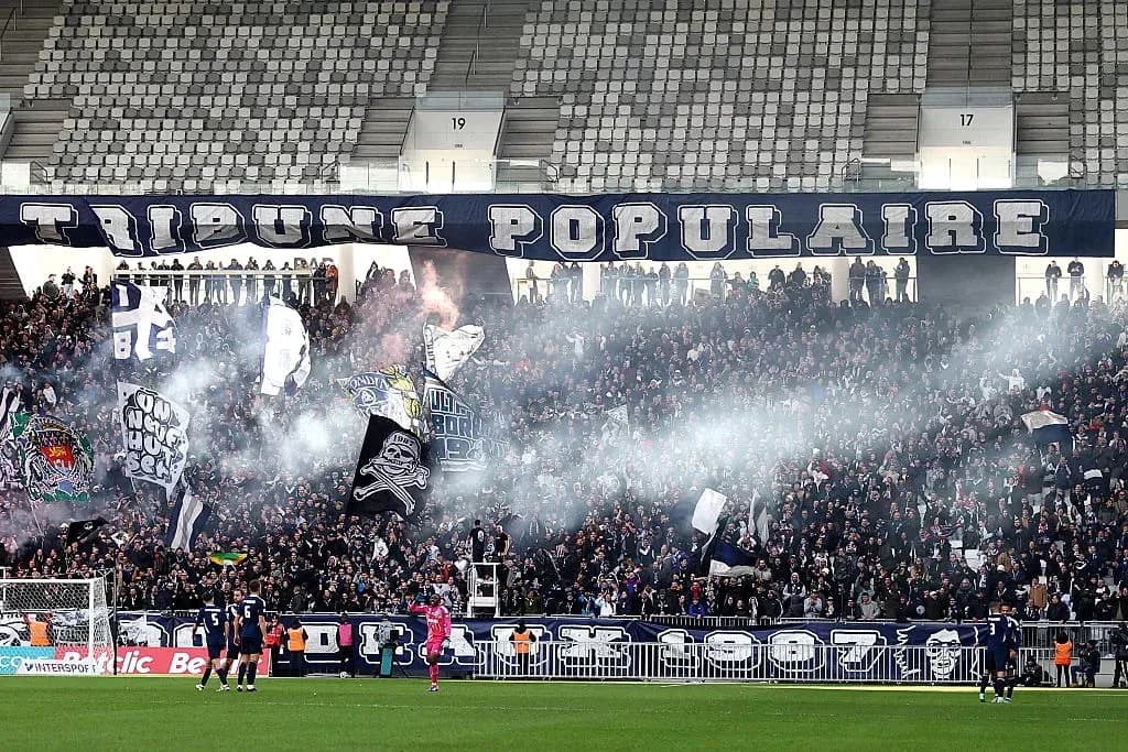 Crowd cheering with banners and smoke in stadium Crowd cheering with banners and smoke in stadium