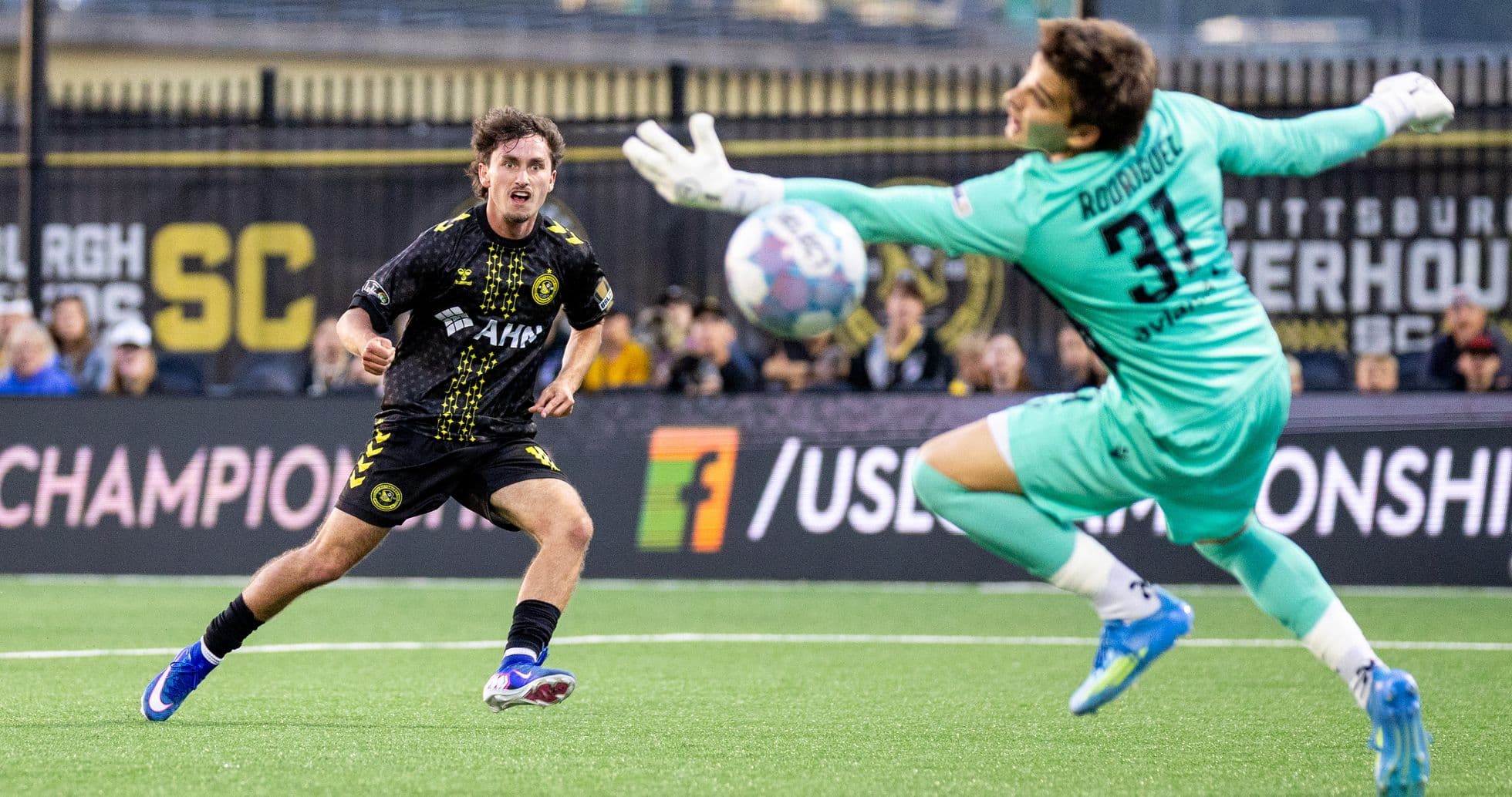 Player shooting on goal against Miami FC Player shooting on goal against Miami FC