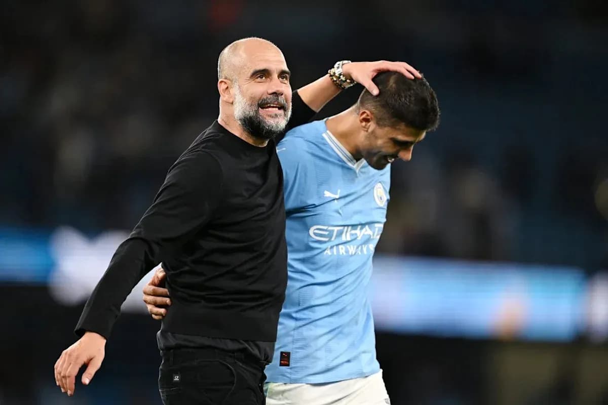 Manager and player celebrating after match victory Manager and player celebrating after match victory