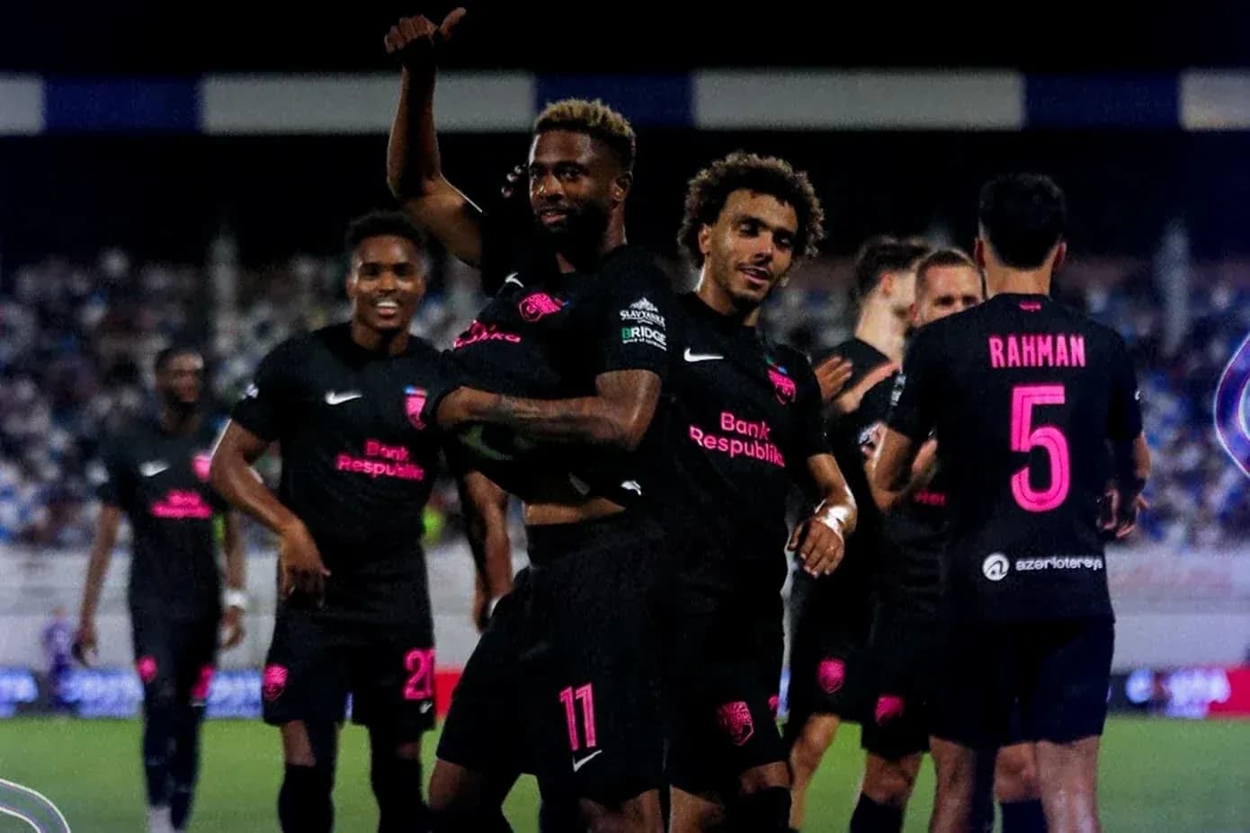 Players celebrating a goal in UEFA match Players celebrating a goal in UEFA match