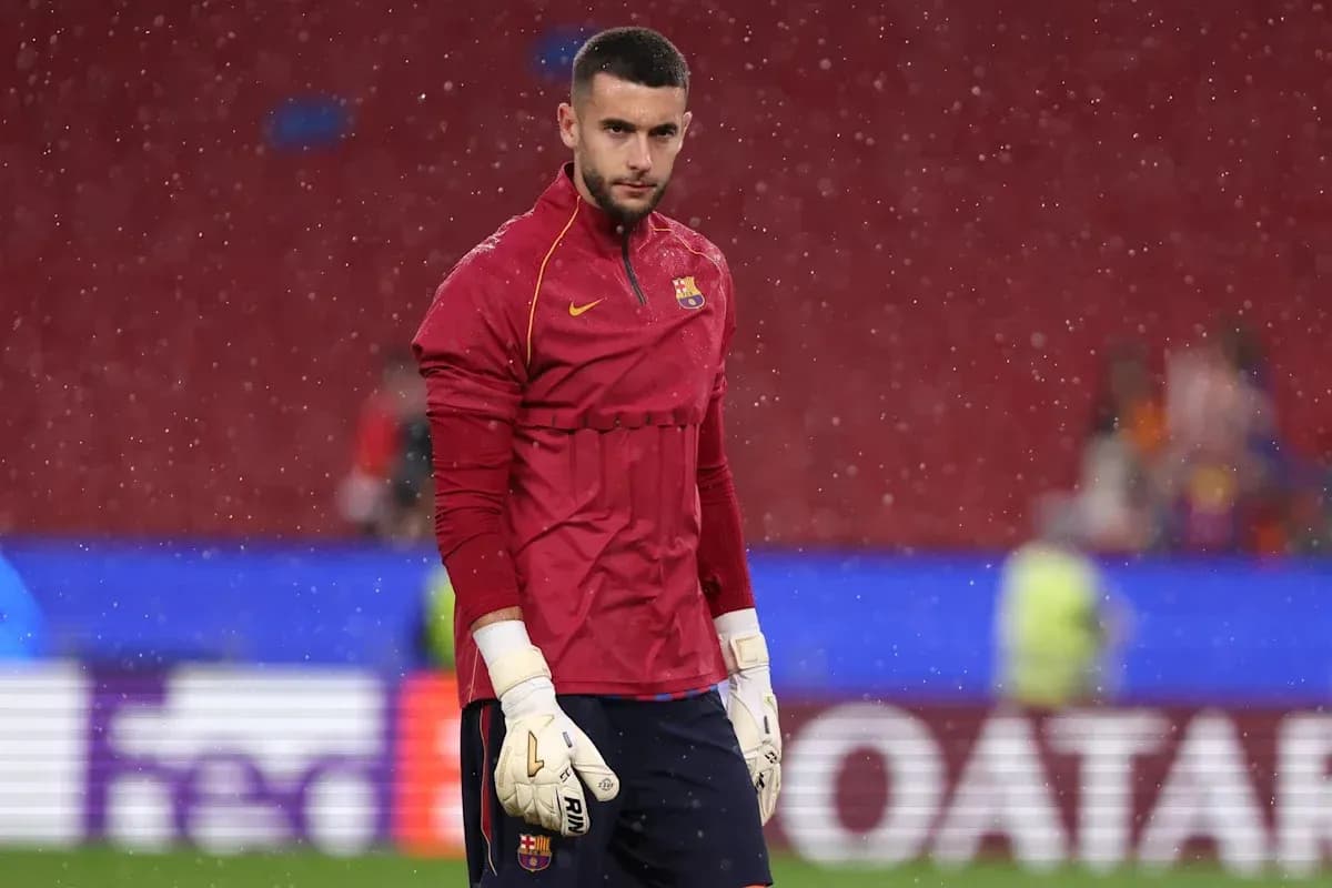 Goalkeeper warming up in rain before match Goalkeeper warming up in rain before match