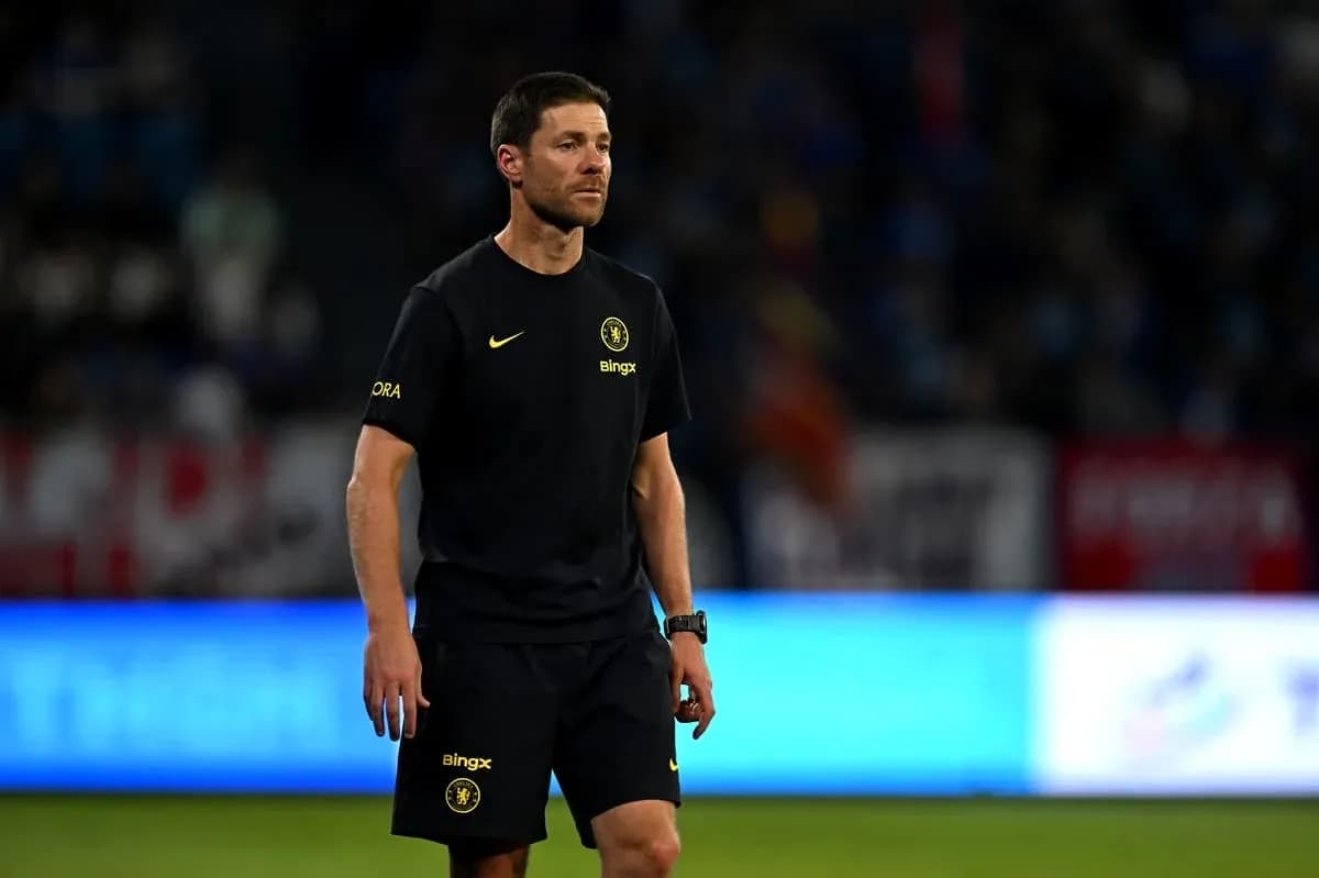 Coach walking on the pitch during match Coach walking on the pitch during match