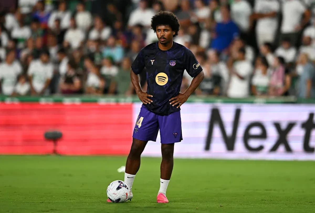 Player preparing to take a free kick on field Player preparing to take a free kick on field