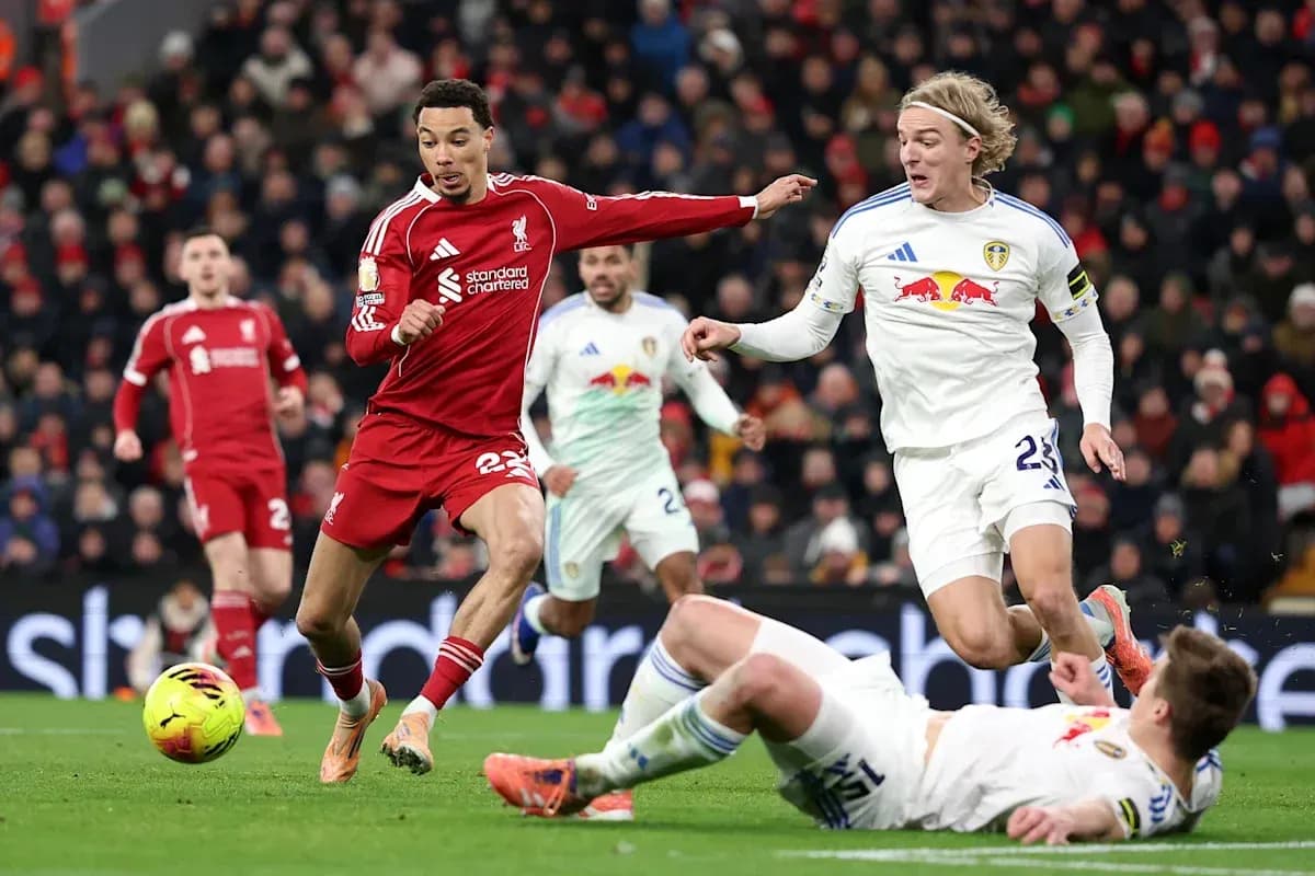 Liverpool player evading Leeds United tackle on pitch Liverpool player evading Leeds United tackle on pitch