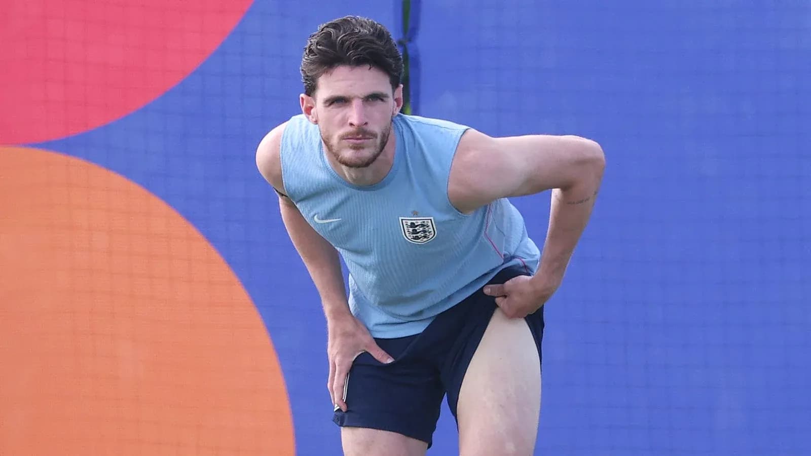 Player stretching during training session in England kit Player stretching during training session in England kit
