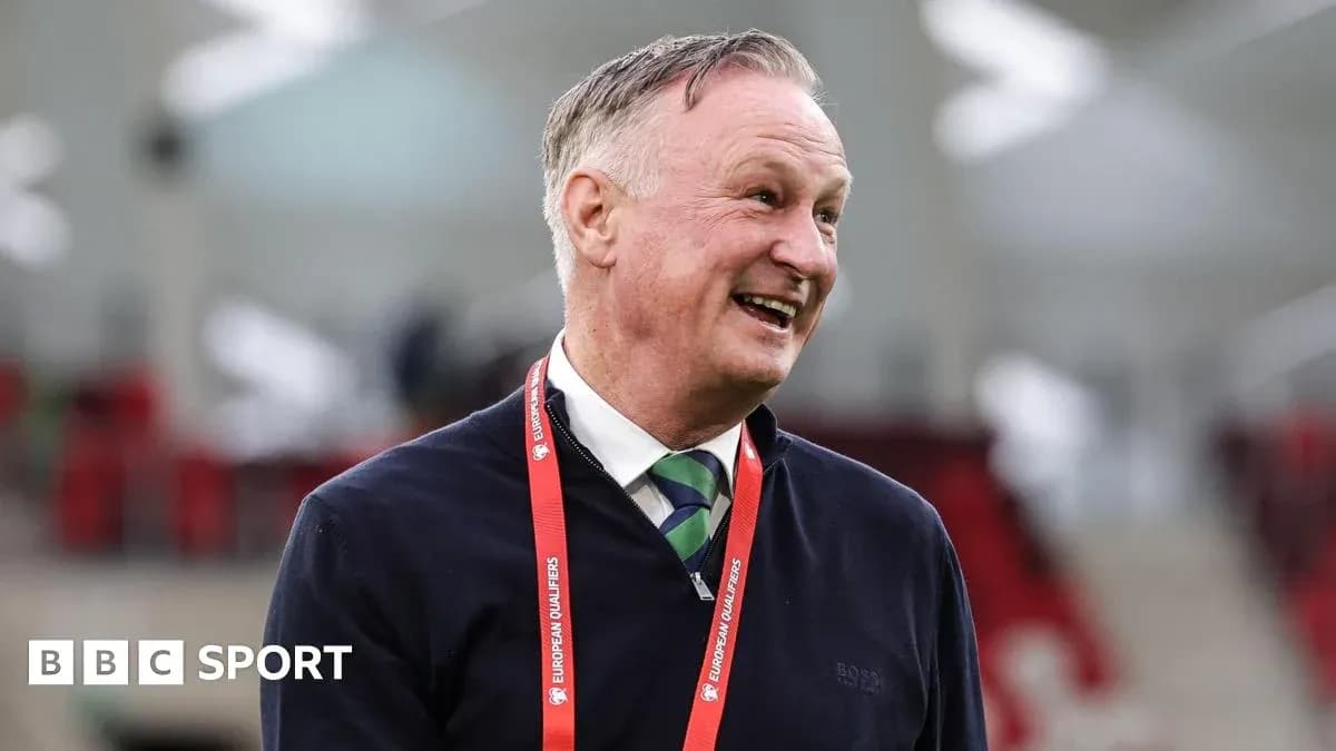 Man smiling in stadium during European qualifiers Man smiling in stadium during European qualifiers