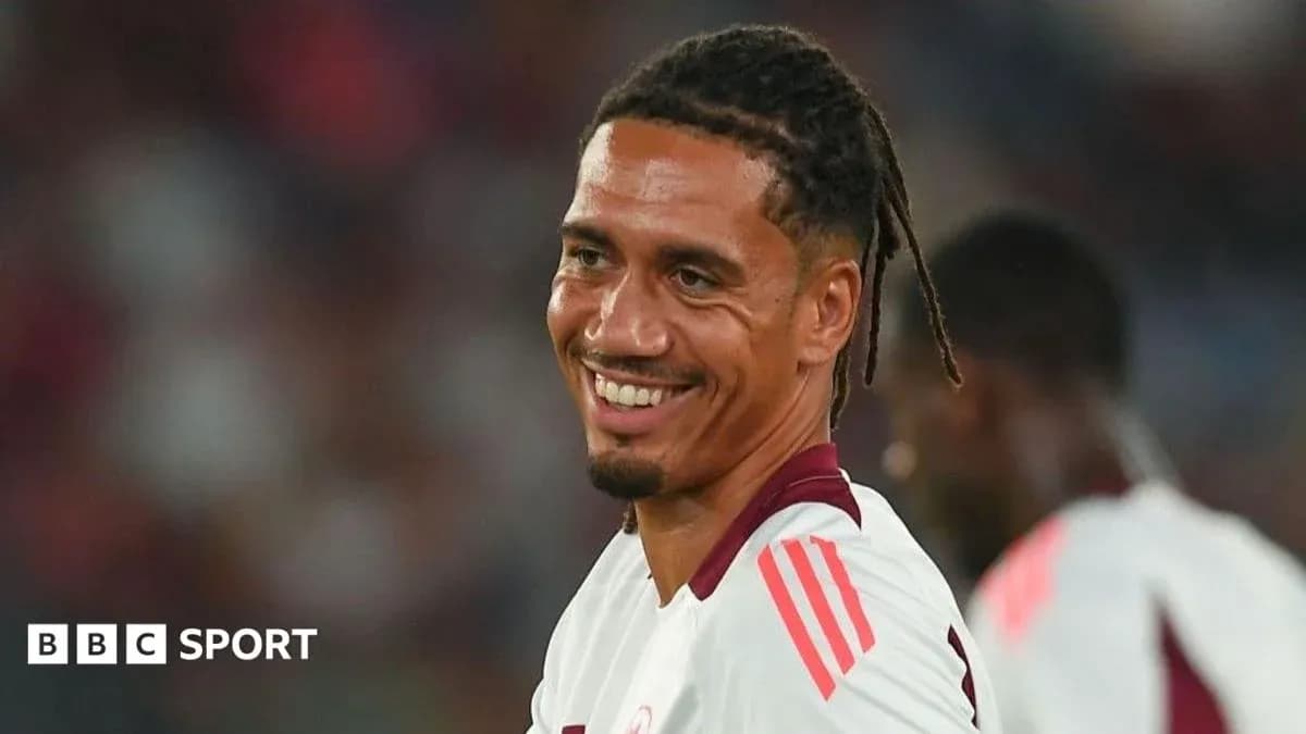 Player smiling during a football match warm-up Player smiling during a football match warm-up