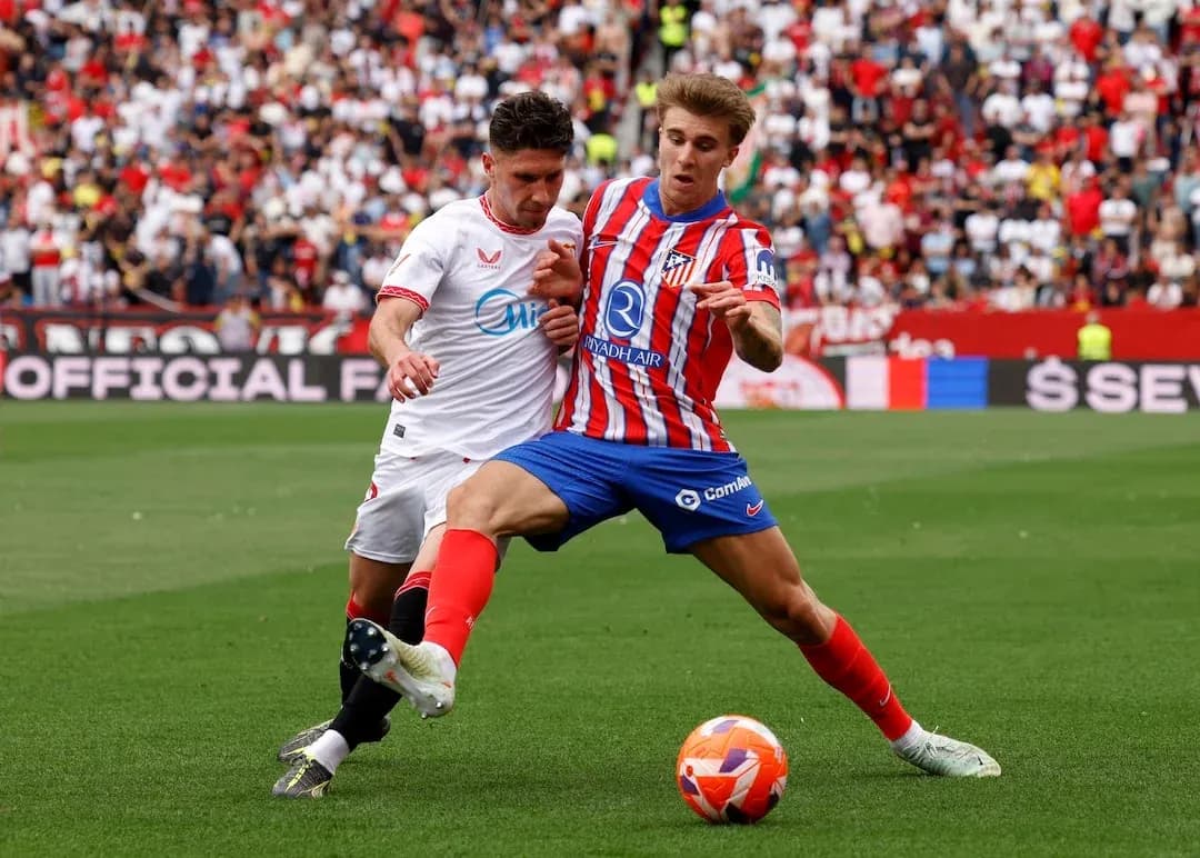 Sevilla and Atletico Madrid players in action Sevilla and Atletico Madrid players in action