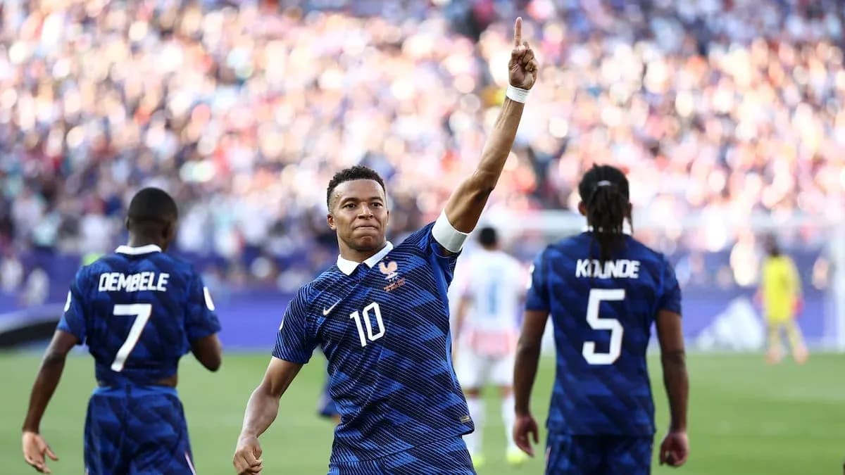 Mbappé celebrating a goal with teammates during match Mbappé celebrating a goal with teammates during match