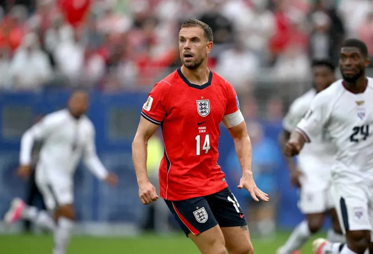 Player in red England kit during match action Player in red England kit during match action
