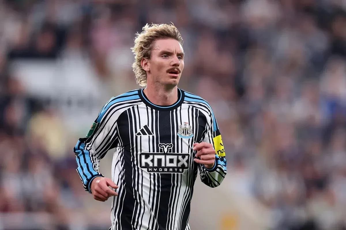Newcastle player running during match at stadium Newcastle player running during match at stadium