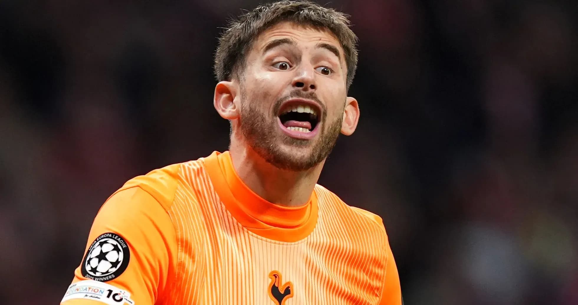 Goalkeeper in orange kit shouting during match Goalkeeper in orange kit shouting during match