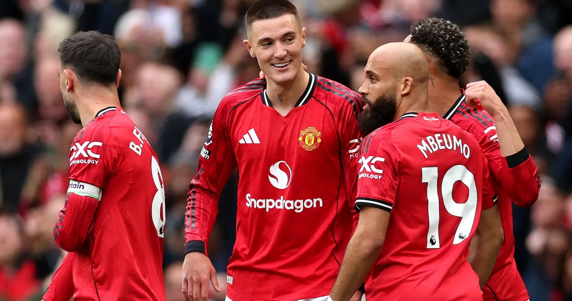 Manchester United players celebrating a goal together Manchester United players celebrating a goal together