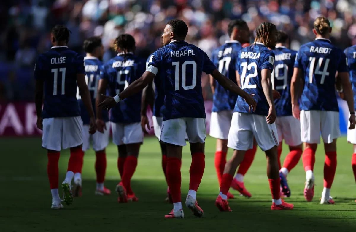 French national team players walking on the field French national team players walking on the field