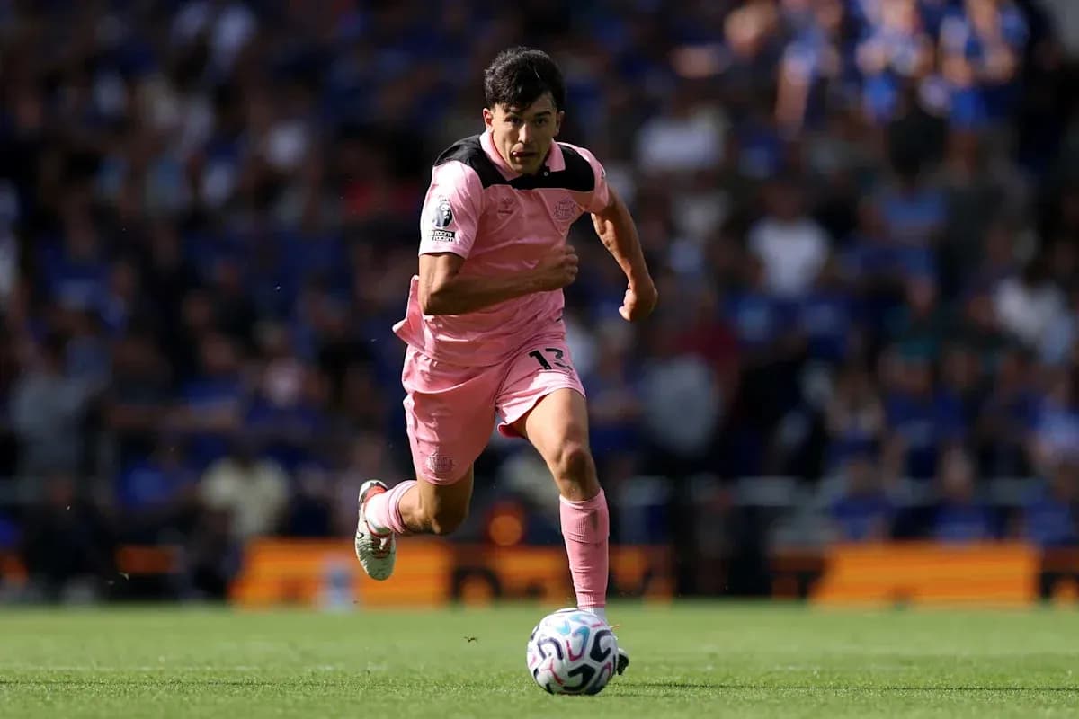 Player sprinting with ball during a match Player sprinting with ball during a match