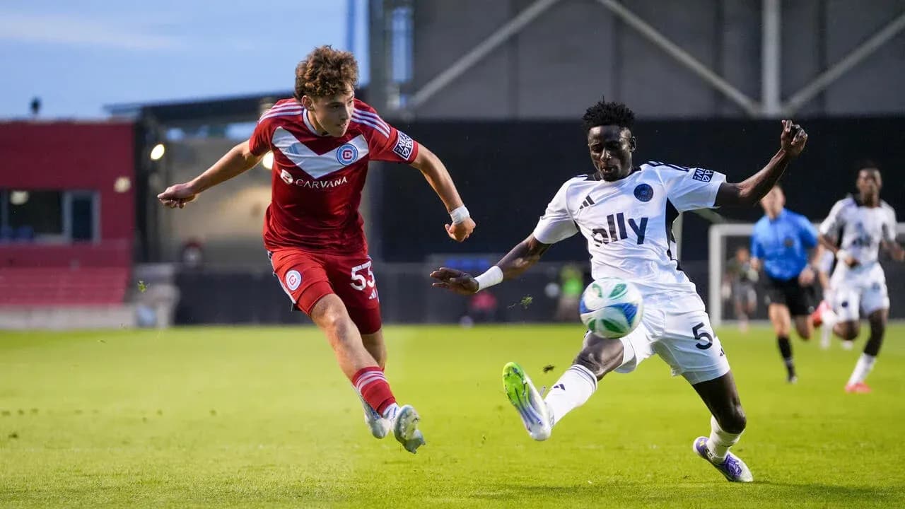 Crown Legacy player tackling Chicago Fire II opponent Crown Legacy player tackling Chicago Fire II opponent