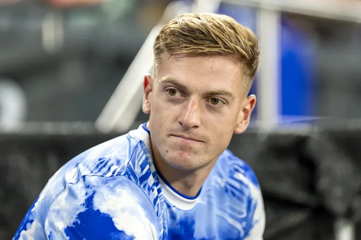 Player sitting on the bench in training attire Player sitting on the bench in training attire