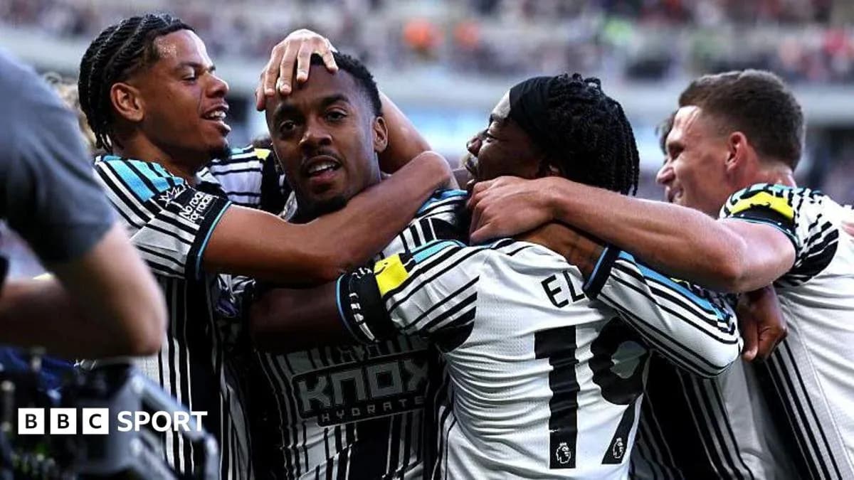 Players celebrating a goal on the field Players celebrating a goal on the field