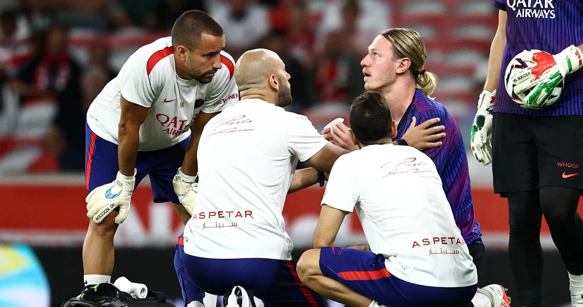 Medical team attending to player on field Medical team attending to player on field