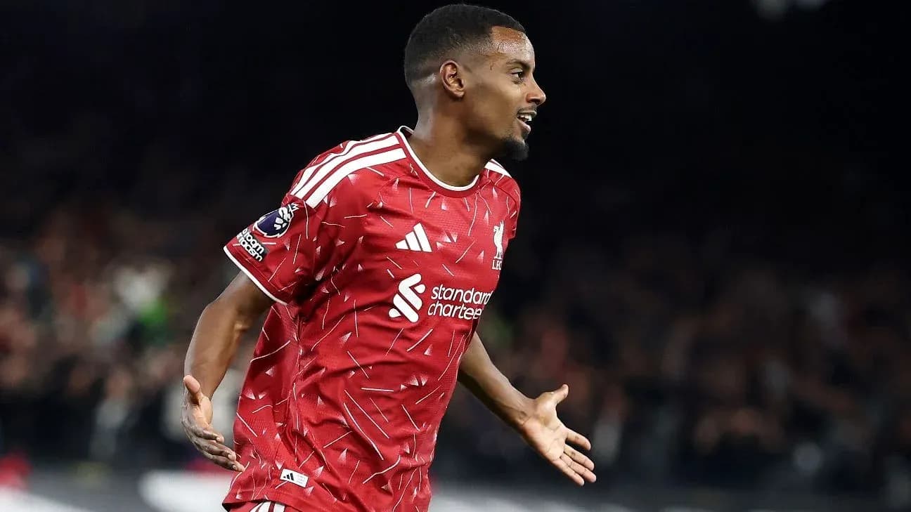 Player celebrating goal in Liverpool kit Player celebrating goal in Liverpool kit