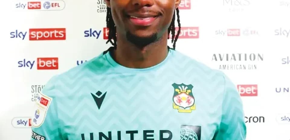 Goalkeeper in team kit smiling for photo Goalkeeper in team kit smiling for photo
