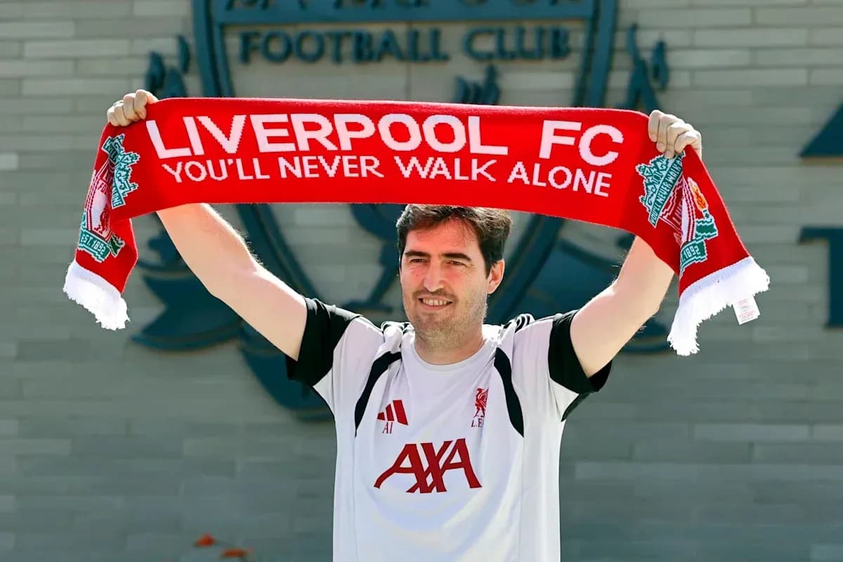 Person holding Liverpool FC scarf outside club Person holding Liverpool FC scarf outside club