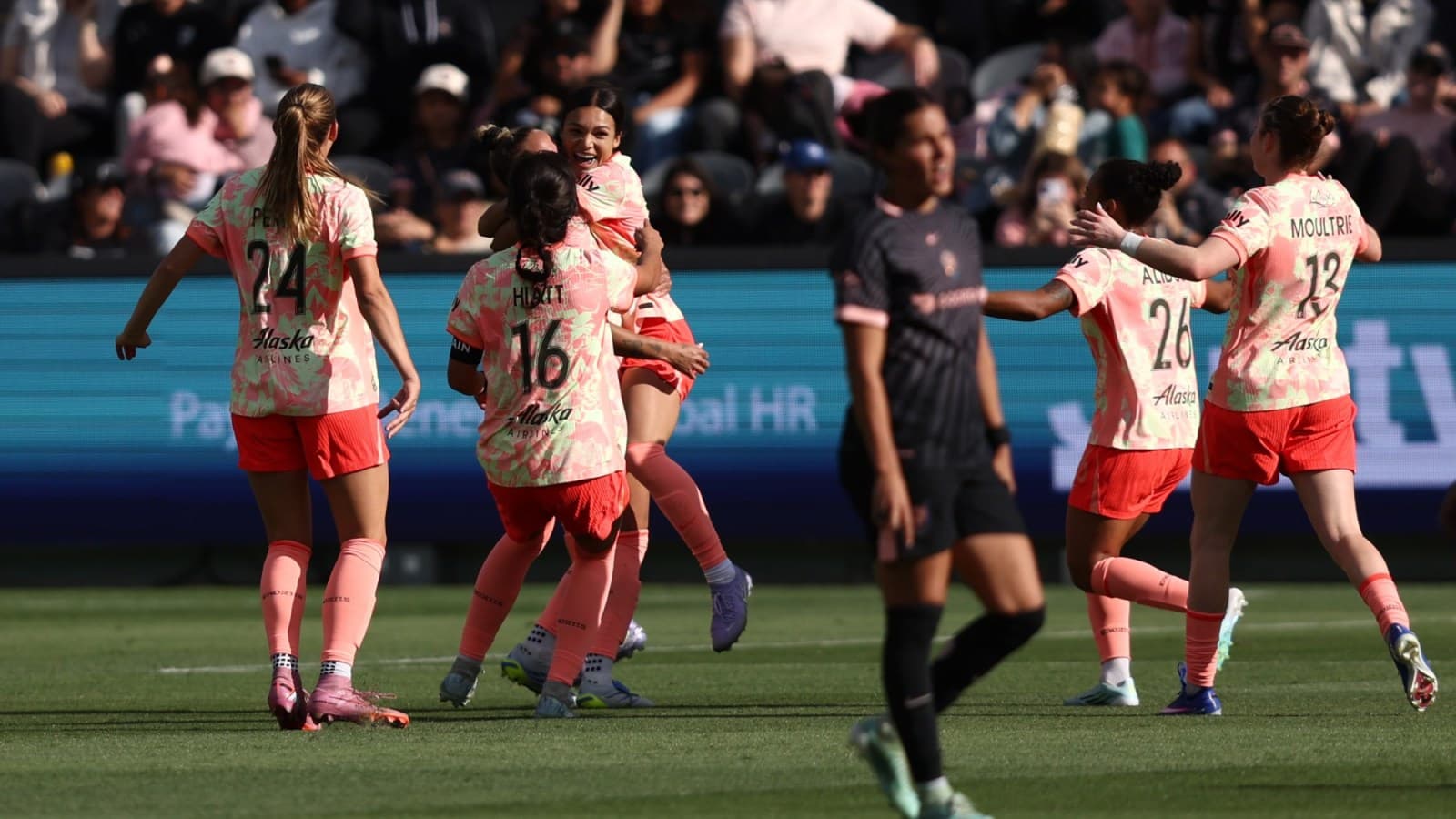 Players celebrating a goal during NWSL match Players celebrating a goal during NWSL match