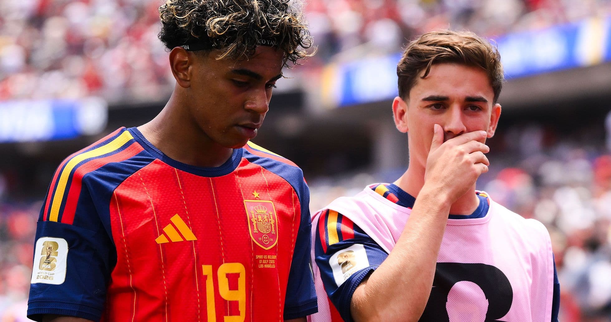 Two Spanish players walking off the field Two Spanish players walking off the field