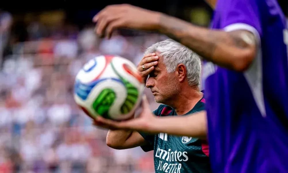 Coach with hand on forehead during match Coach with hand on forehead during match