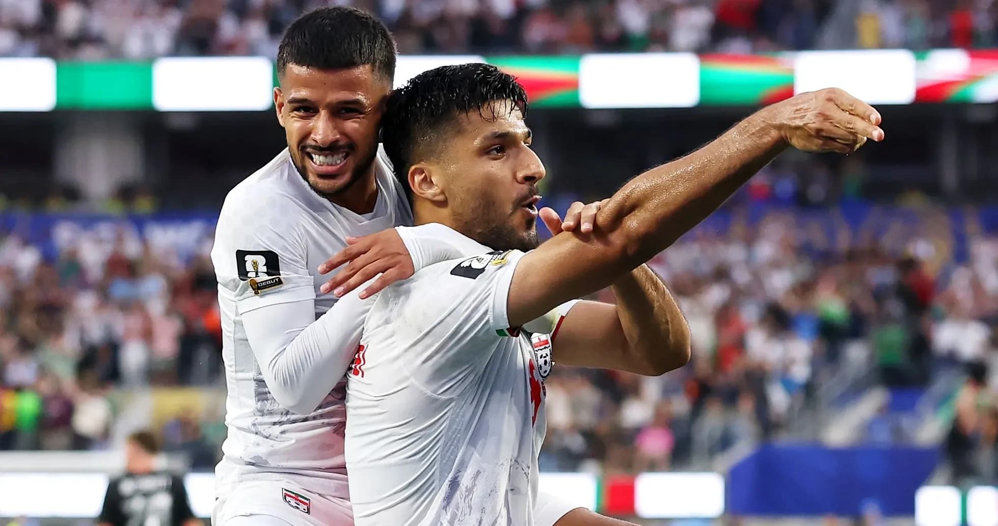 Players celebrating a goal during a match Players celebrating a goal during a match