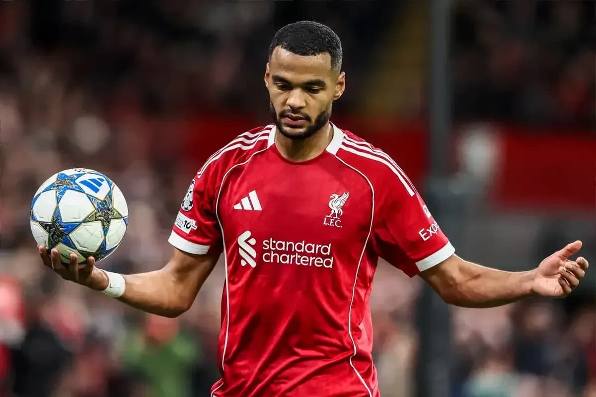 Player in red jersey holding a football Player in red jersey holding a football