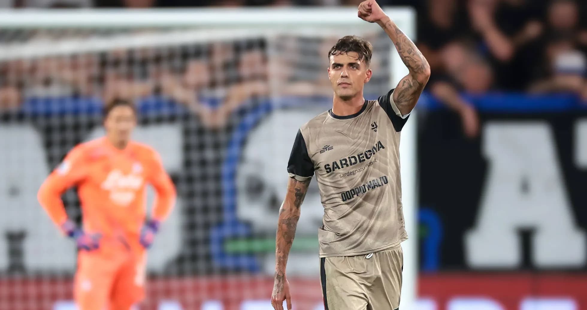 Player celebrating with raised fist on the field Player celebrating with raised fist on the field